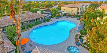 Relaxing resort-style pool with sundeck and spa